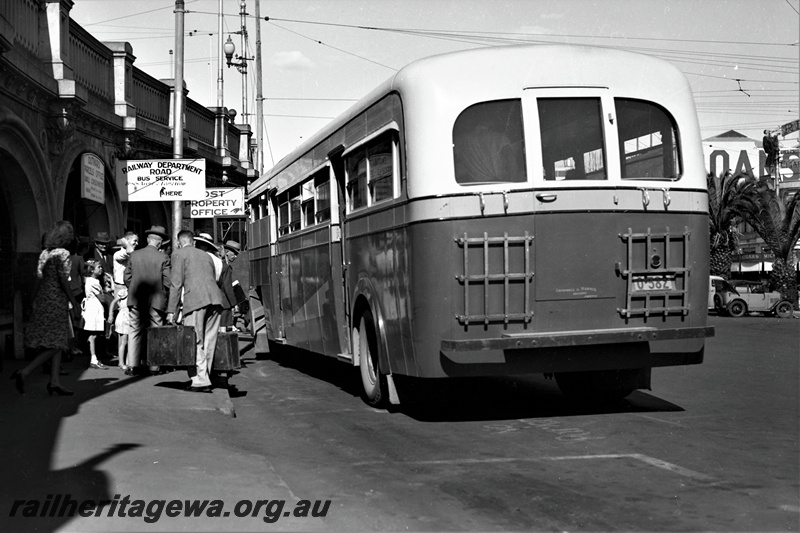 P22029
Railway Department Road Bus Service bus, licence plate 0-382, passengers boarding, William Street bridge, undercroft, Perth, side and rear view
