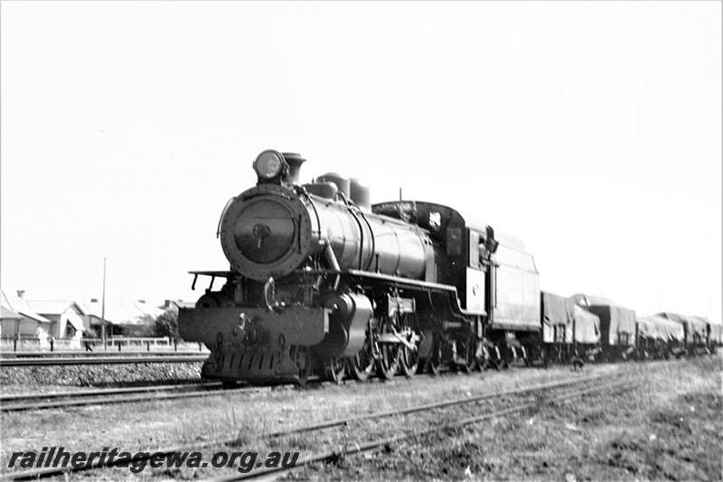 P22048
Unidentified U Class steam loco, on suburban goods train, tracks, front and side view
