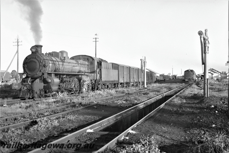 P22050
PMR Class 721, on goods train, X Class loco on passenger train, station building, platforms, water cranes, shed, ash pit, front and side view from track level, water columns, Pinjarra, SWR line
