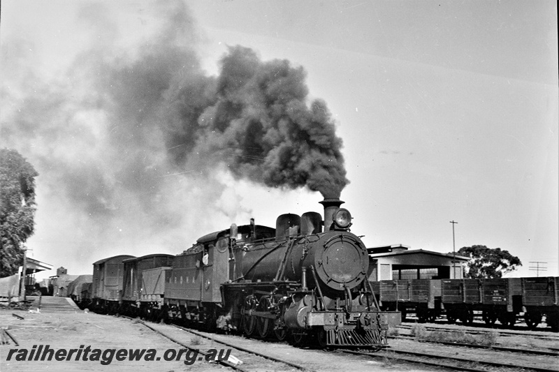 P22056
MRWA C class loco, on goods train, scotch block, platform, station building, yard, wagons, loco shed, Watheroo, MR line. side and front view
