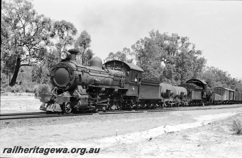 P22067
F class 450 & F class 464 , tender to tender with two J class water tank wagons between them,  No.11 mine shunter at Muja. BN line., front and side view of the locos

