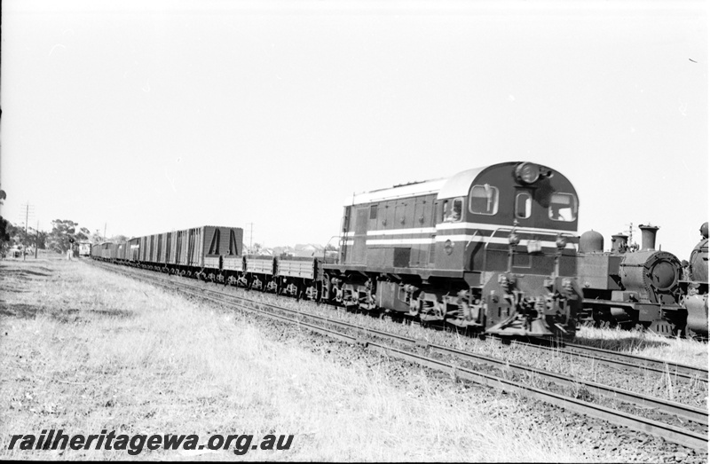 P22077
F class hauling Fremantle bound goods passing East Perth loco depot. ER line 
