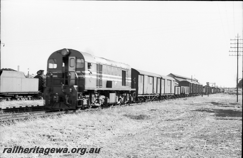 P22083
G class hauling Midland goods passing East Perth Loco depot. ER line.
