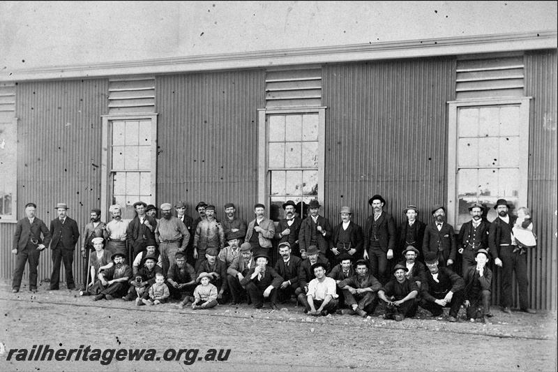 P22169
Group photo, railway staff and family, outside railway building, Coolgardie, EGR line,
