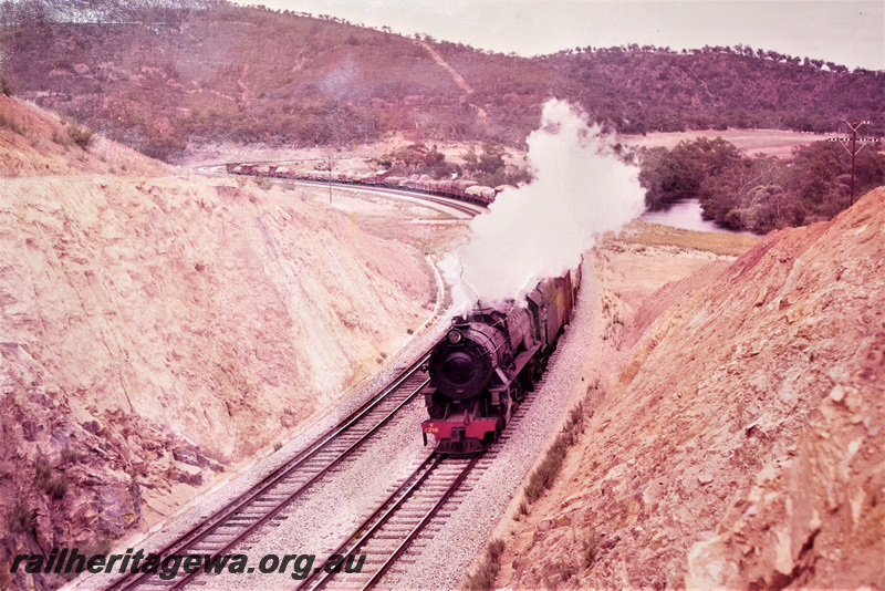 P22216
V class 1216, on goods train, entering dual gauge cutting, Avon Valley line, front and side view form elevated position
