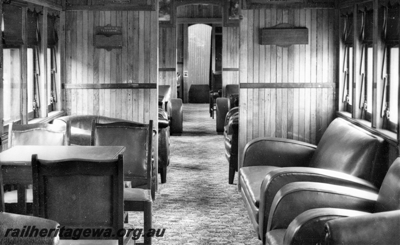 P22223
Interior of AYL class lounge car, showing compartment with table and chairs, lounge chairs and two-seater lounge 
