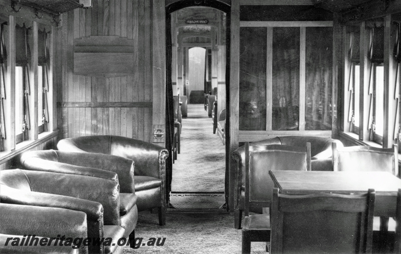 P22224
Interior of AYL class lounge car, showing compartment with table and chairs, and lounge chairs 
