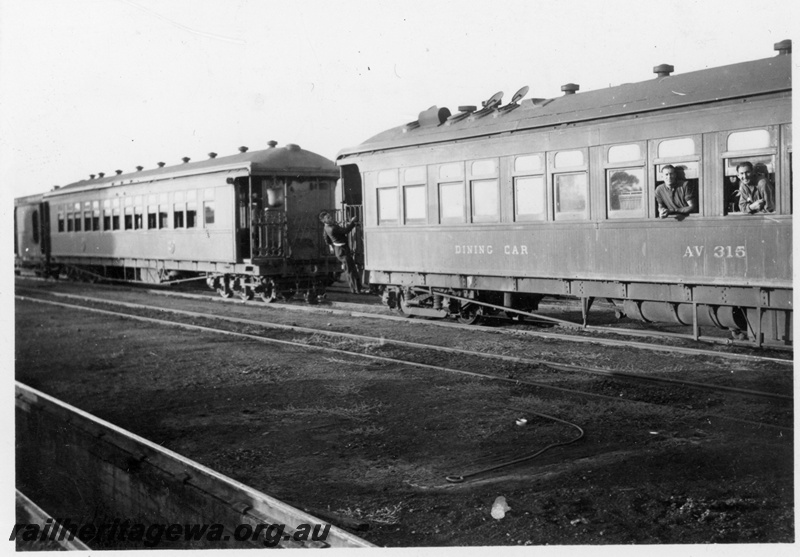 P22254
AV class 315 dining car, with passengers on steps and hanging out windows, another passenger carriage with water bag on end platform, side and end view
