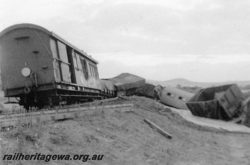 P22267
Bringo Crash 2 of 2, guards van, wagons derailed, track torn up, Bringo, NR line, view from rear of train at track level 
