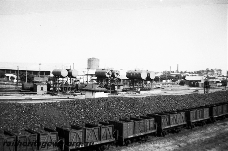 P22326
East Perth loco showing coal stock pile and diesel fuel tanks in background. ER line.
