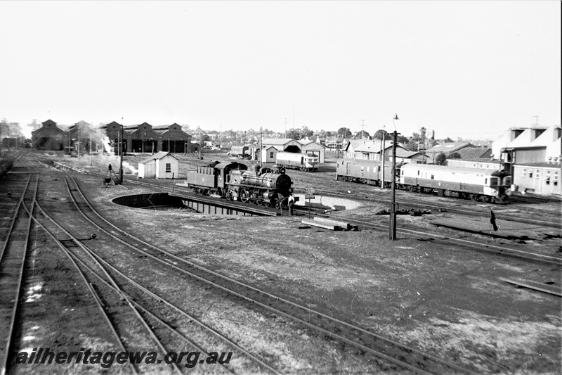 P22328
East Perth loco showing Pmr loco on turntable and ADH class railcar in country configuration and ADF in background. ER line.
