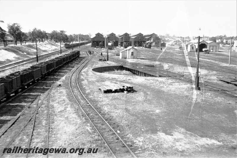 P22329
East Perth loco showing turntable and M class coal boxes. ER line.
