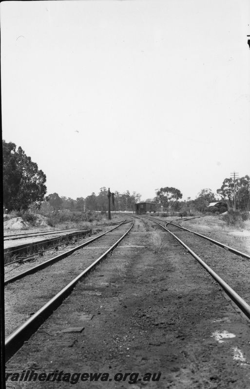 P22345
Views of Koojedda 1 of 3, station building, platform, water crane, points, sidings, tracks, Koojedda, ER line, photo taken through open door 
