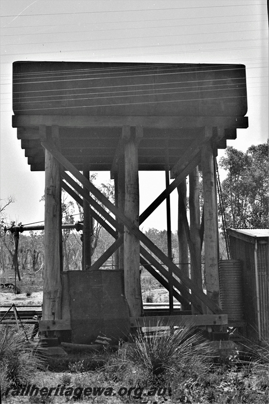 P22348
Water tower with 13000 gallon cast iron tank, water crane, sheds, Koojedda, ER line, view from behind tower at ground level
