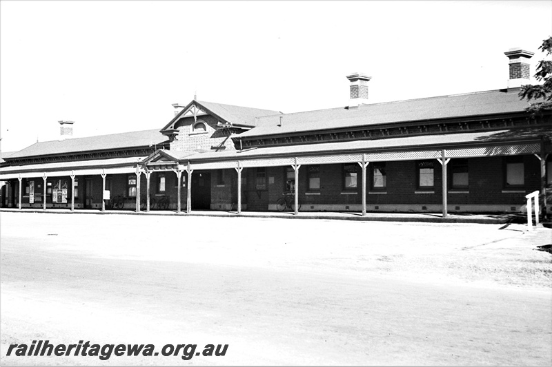 P22360
Railway station facade, car park, Northam, ER line, view from roadside 
