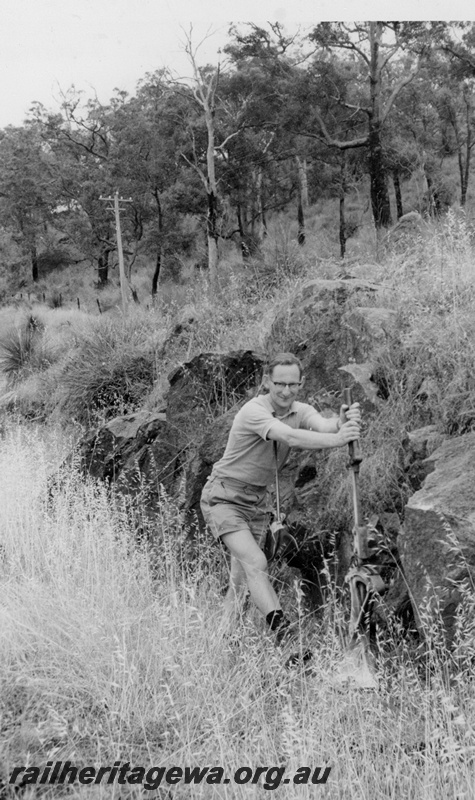 P22372
Point lever to Mountain Quarries line, being operated by the late John Joyce  on Bellevue to Mt Helena line, M line, trackside view
