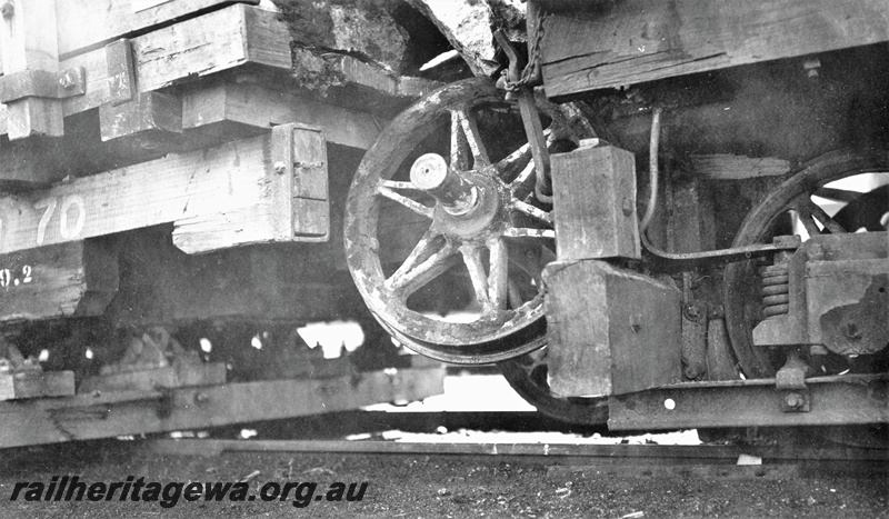 P22377
Perth stone train derailment 4 of 5, wagon numbered 70, another wagon, with wheel jammed between, close up view from trackside 
