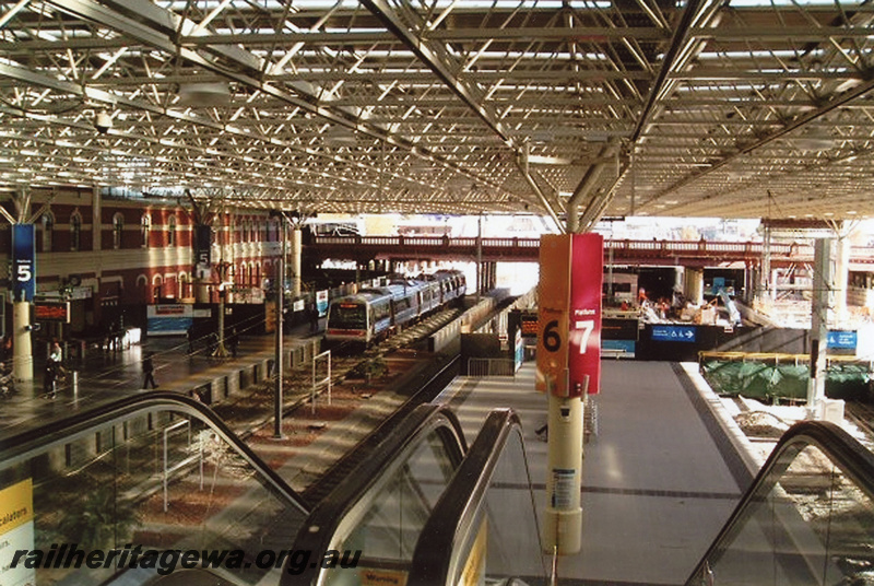 P22397
Interior view of Perth station, DMU railcar set, station building, platforms 5, 6, 7, horseshoe bridge, escalators, works in progress, Perth, ER line, photo taken from top of escalators
