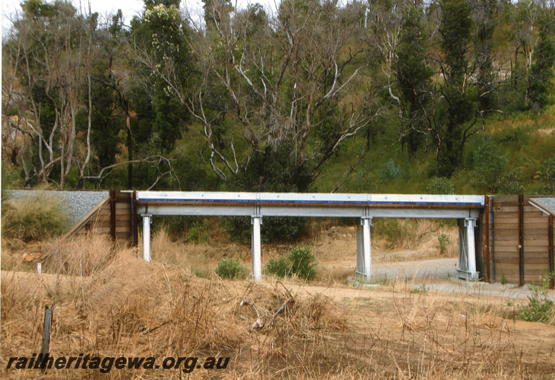 P22404
Bridge, wood and steel, renewed by Puffing Billy volunteers after fire burn out, east of Isandra, PN line, side view
