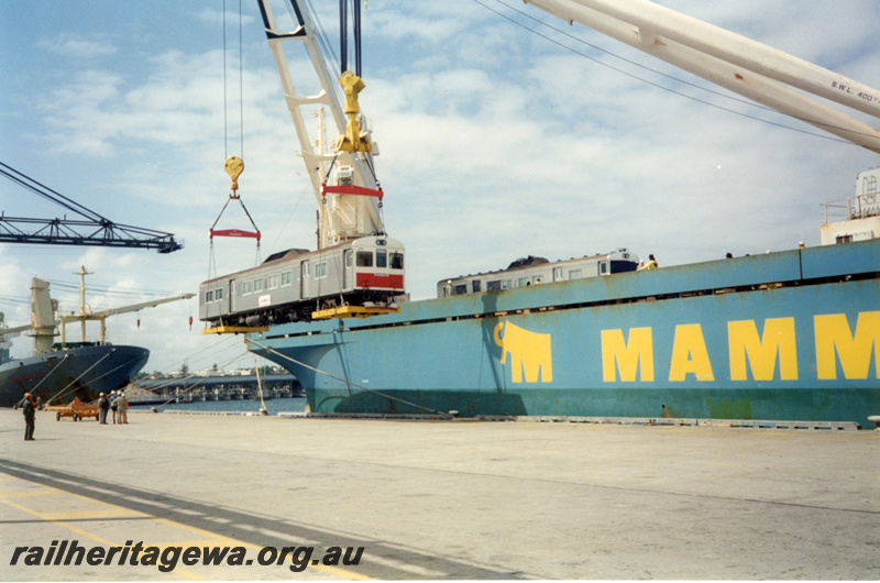 P22416
ADK class railcar, being lifted by shipboard crane onto 