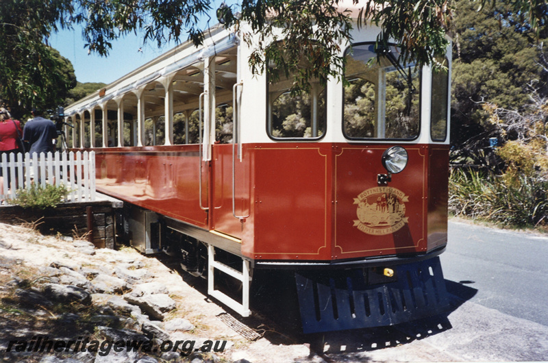 P22418
Rottnest Island Oliver Hill Railway railcar, with insignia on end of carriage, platform, onlookers, Settlement station, Rottnest Island, side and end view
