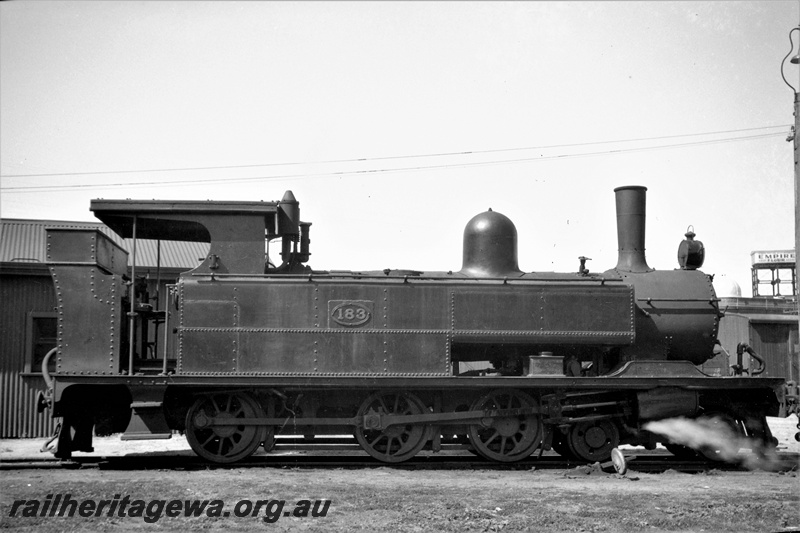 P22437
B class 183, with stovepipe chimney, water tower, sheds, side view
