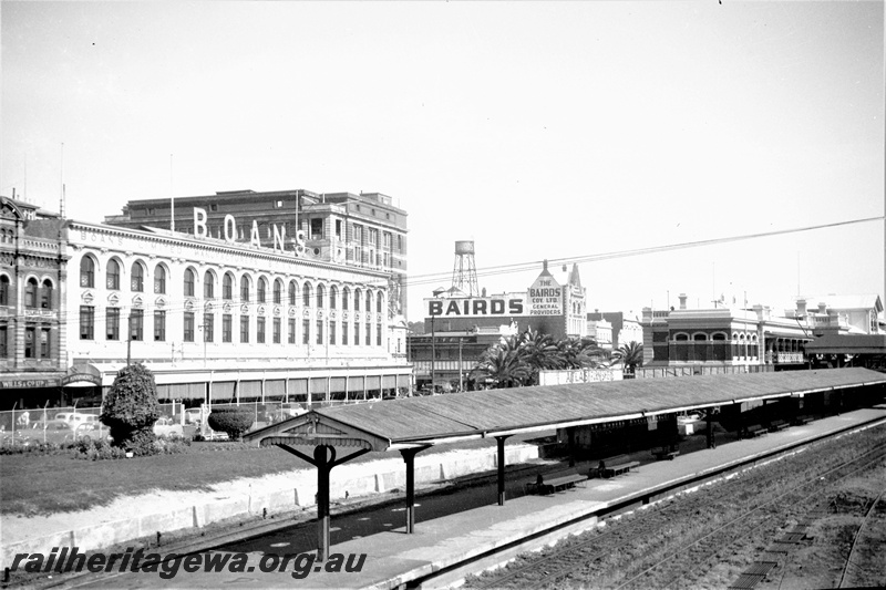 P22438
Platform, canopy, station building, tracks, Boans department store, other city buildings, Perth station, view from elevated position
