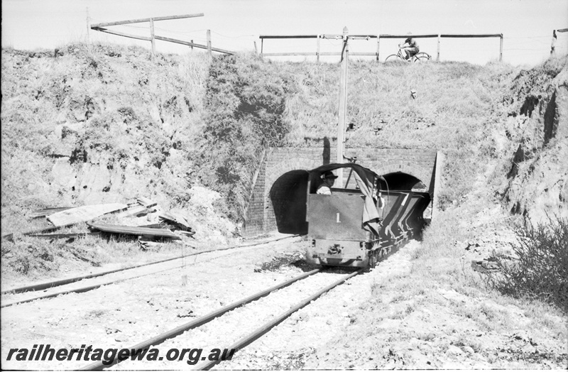 P22485
Australian Railway Historical Society Western Australian Division tour to Maylands brickworks 8 of 16, loco no 1 haling wagons, near dual tunnel portals, driver, cyclist, view from trackside 
