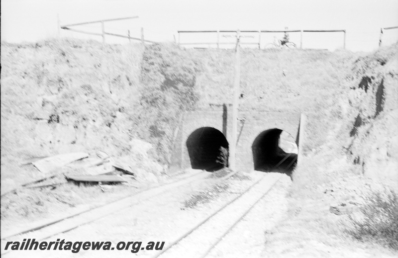 P22486
Australian Railway Historical Society Western Australian Division tour to Maylands brickworks 9 of 16,dual  tunnels through hillside, tracks, view from trackside
