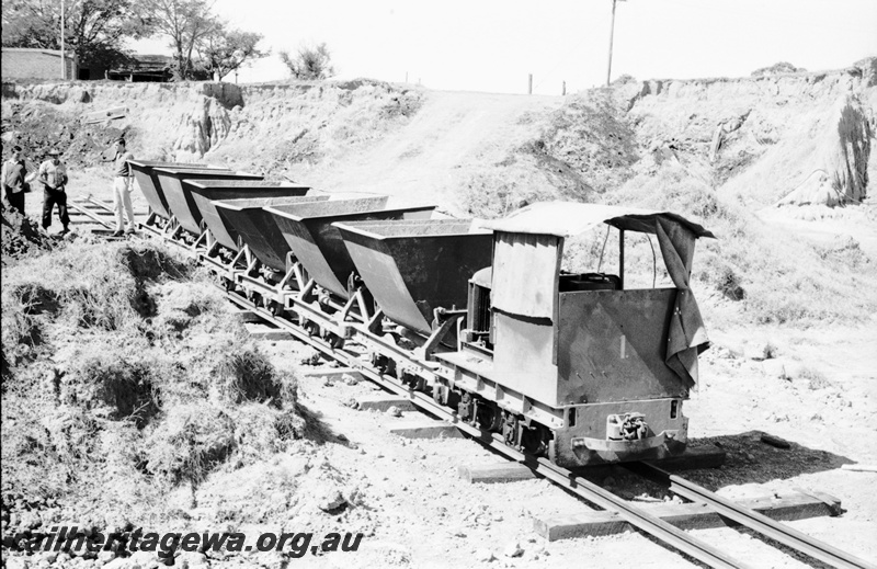 P22487
Australian Railway Historical Society Western Australian Division tour to Maylands brickworks 10 of 16, loco no 1 on train of 6 wagons, tracks, pit, members, side and front view
