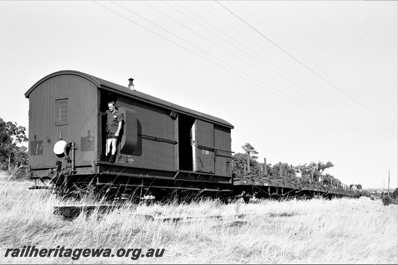 P22497
Rail reclamation on the ER 4 of 10, F class 43 pushing rail recovery train around Blackboy Hill, heading to Swan View, Z class133 van leading, guard, ER line, end and side view from trackside 
