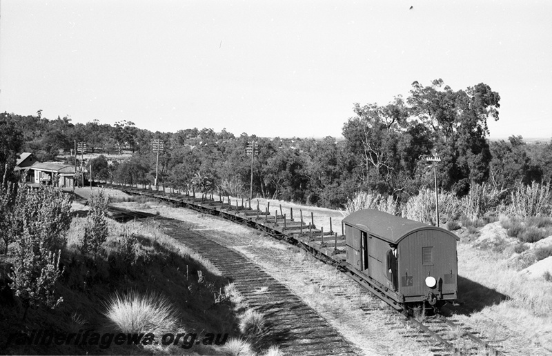 P22501
Rail reclamation on the ER 8 of 10, F class 43 pushing empty rail recovery train through Swan View station, station building, ER line, side and end view 
