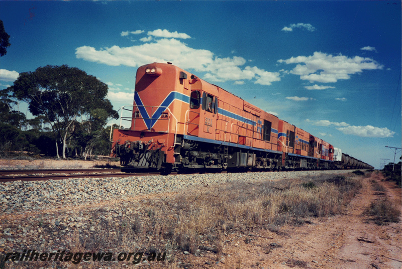 P22509
K Class 201 triple heading with two other K Class on the Esperance fuel train bound for Kalgoorlie, gangers caravan on WF Class flat wagon
