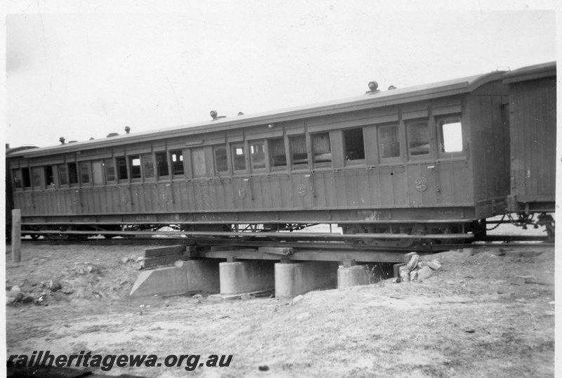 P22559
Derailment of 14 wagons of No 77 Fast Mixed near Konnongorring EM line on 8 January 1949 No 3 of 6, ACL class 403 on culvert, trackside view
