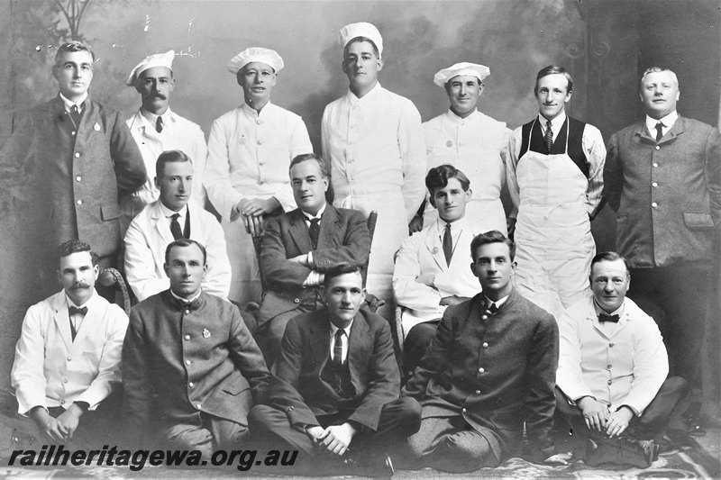 P22586
Group photo of crew of Prince of Wales train, Trans-Australia Railway. Back row: W. Martin, J. McNamara, A. McInness, F. Page, J. O'Keefe, J. Leigh, J.E. Hammond. Middle row: B. Brandle, H. Fletcher, J. Byrne. Front row: C. Ridley, J. Richardson, A. Brown, W. Barnes, H. Wilson.
