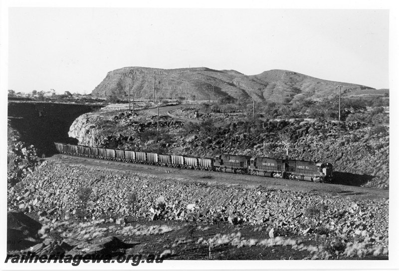 P22593
Hamersley Iron locomotives 3016, 4043 and 4011 triple heading up iron ore train, 276 km, Pilbara, side and front view
