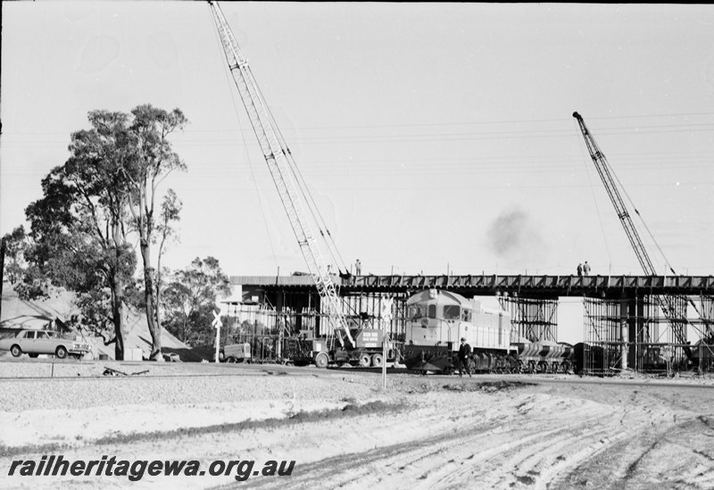 P22634
Construction of Kalamunda Road bridge Midland-Forrestfield railway. J class hauling ballast train in photo. ER line.
