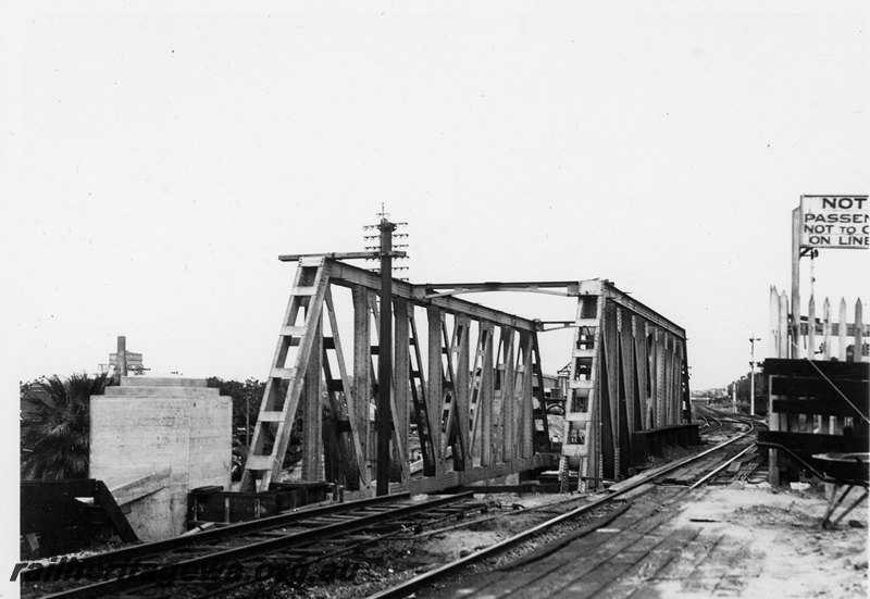 P22758
Extension of Mt Lawley subway ER line No 7 of 15, steel trusses in place, pylon, signal, gasometer, view along tracks looking south

