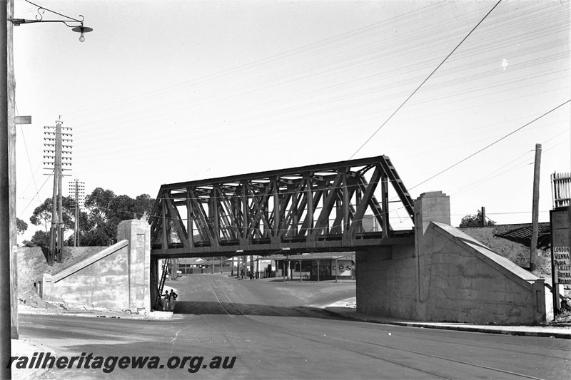 P22764
Extension of Mt Lawley subway ER line No 13 of 15, truss bridge, pylons, subway, shops, view looking west from road level
