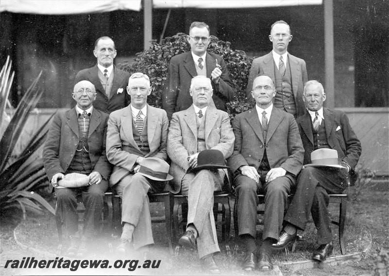 P22768
Group photo, 8 district engineers, in front of District Engineers Office, Midland, ER line
