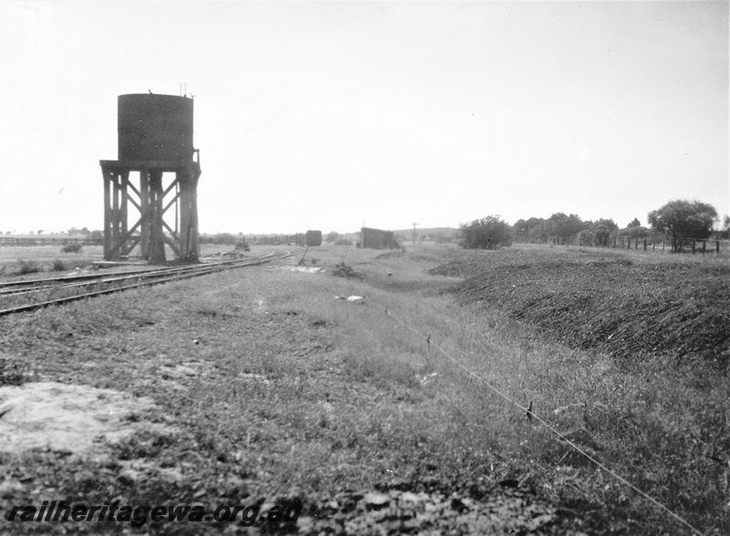 P22772
Water tower, trackside buildings, tracks, rural setting, view from trackside
