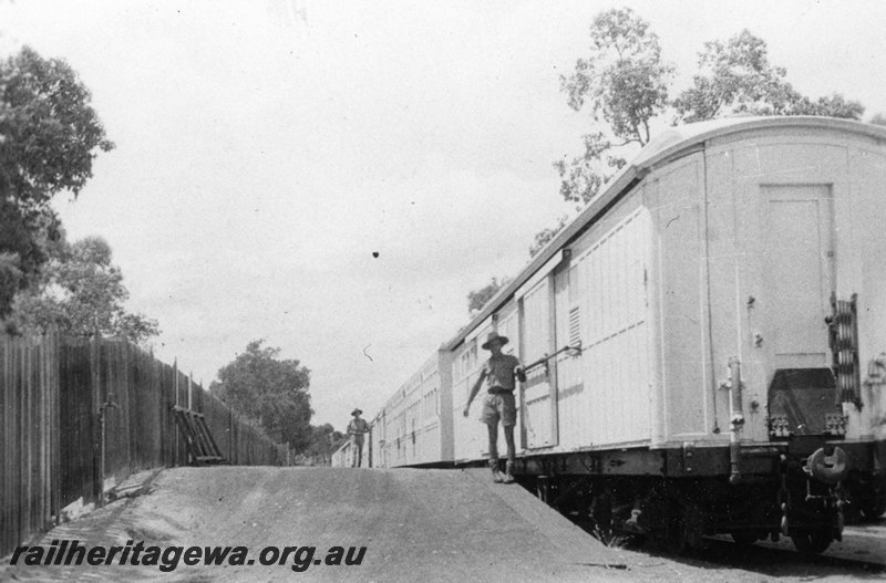 P22783
Ambulance train comprising white van and carriages, platform, onlookers, Helena Vale racecourse siding, ER line, side and end view from track level
