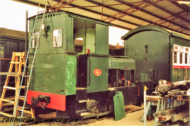 P22793
Diesel shunter No 4, under refurbishment, carriages, work bench, ladders,  Railway Museum, Bassendean, ER line, rear and side view
