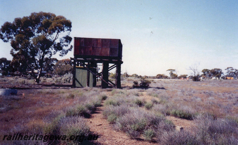 P22848
Water tower, shed beneath, Widgemooltha, CE line, ground level view looking south
