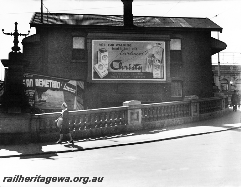 P23621
Signal box B, with advertising, pedestrian, Beaufort Street, Perth station, ER line, view from street
