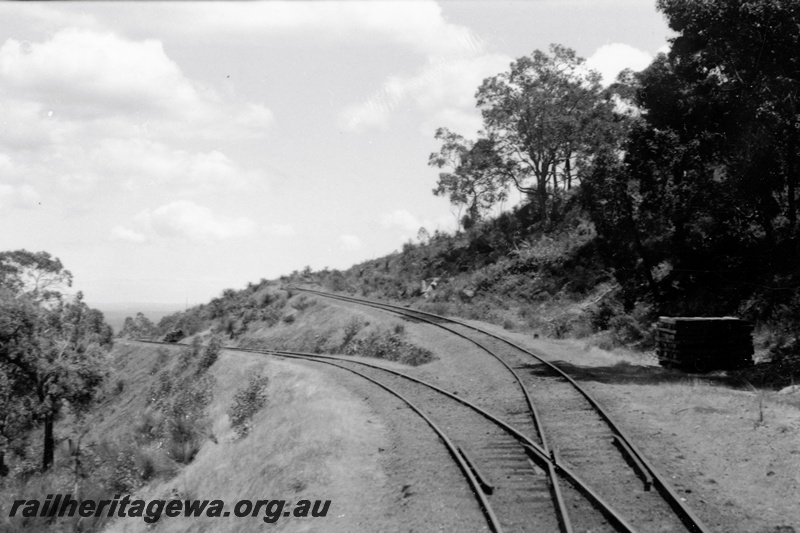 P23782
Points at the diverging tracks, stacks of sleepers trackside UDDR line, view looking along the line
