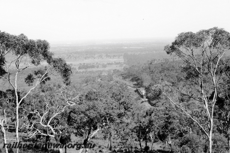 P23783
Goods train  with empty open wagons and an AD class carriage with a white tail disc, on a leg of the Zig Zag,  UDDR line, elevated distant view of the location showing the diverging tracks
