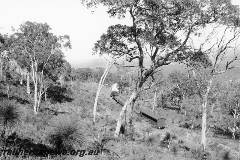 P23786
Goods train  with empty open wagons and an AD class carriage with a white tail disc, on a leg of the Zig Zag,  UDDR line, elevated view looking  down on the train, same train as in P23783

