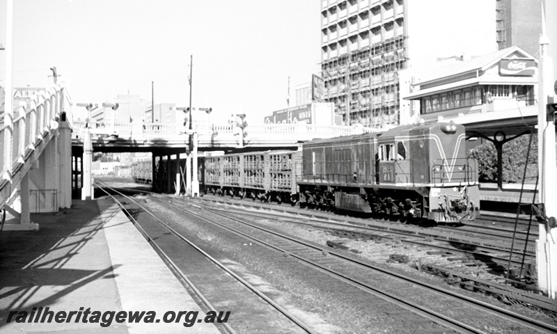 P23947
RA class 1918 on livestock train, bracket signals, road bridge, ramp, platforms, signal box cabin C with 