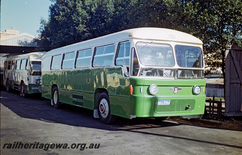 P24203
Railway Road Service  bus WAG8984, portion of another bus, bus depot, Perth, side and front view
